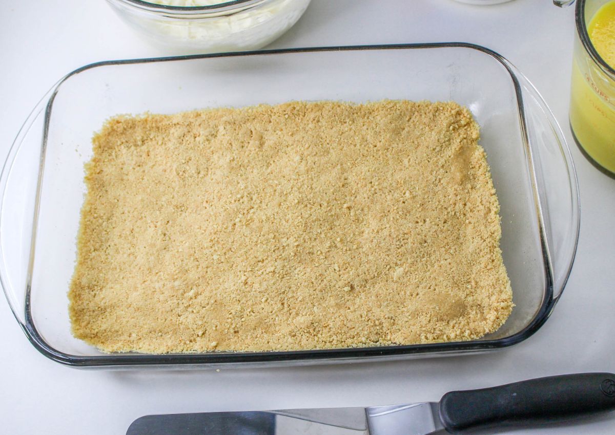 graham cracker crust pressed into a glass baking dish