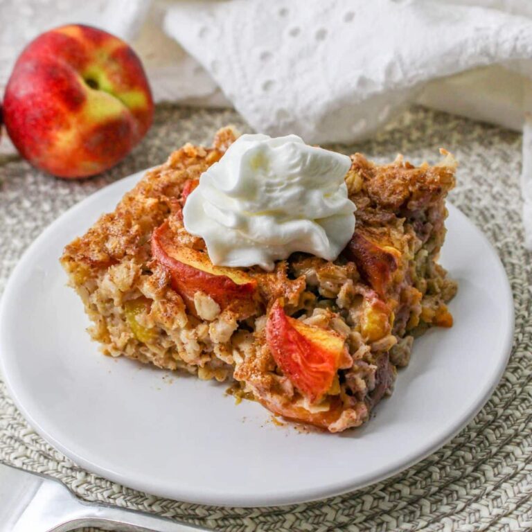 slice of peach baked oatmeal on a white plate