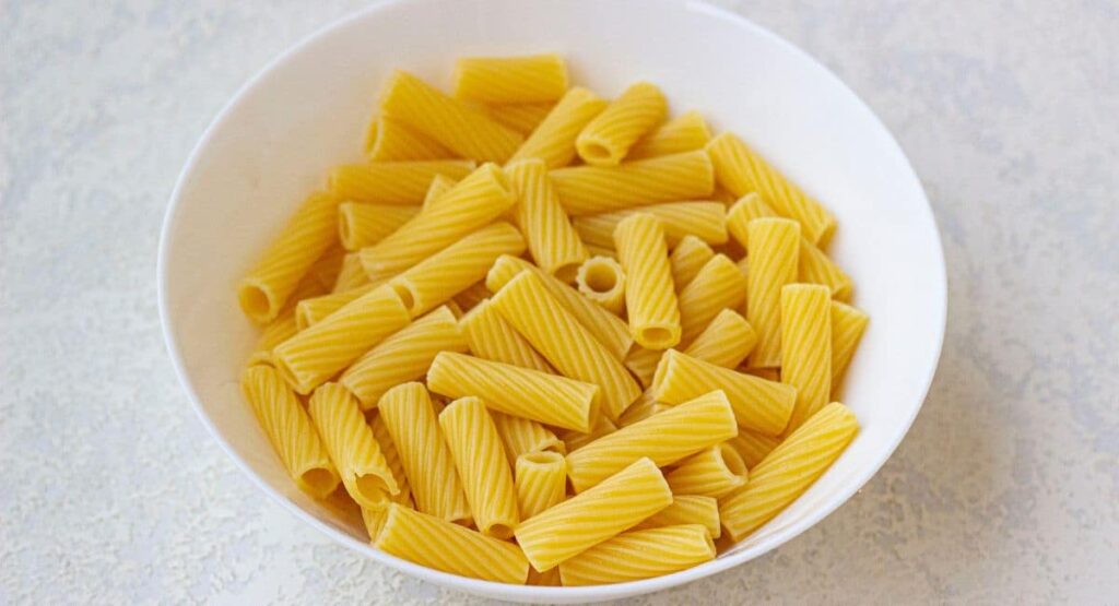 cooked pasta in a white bowl
