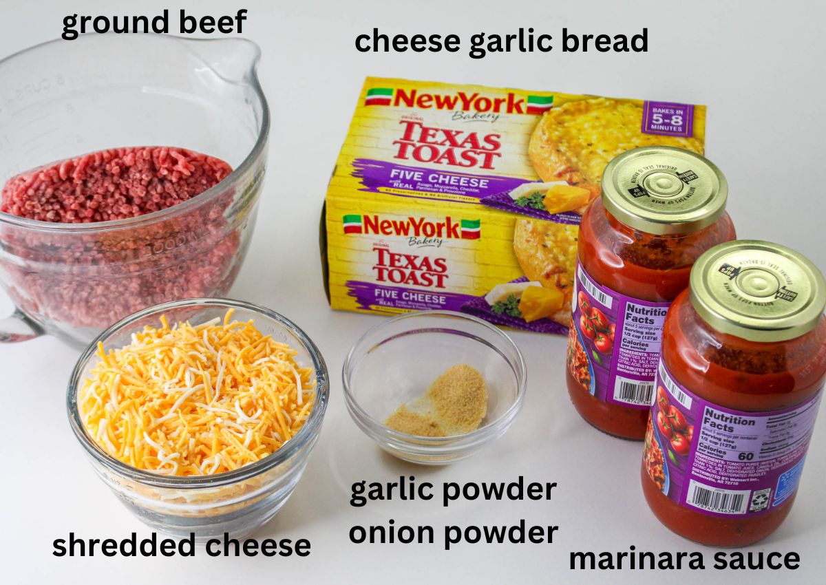 bowls of ground beef, shredded cheese, garlic powder, onion powder, cheese garlic bread and marinara sauce on a white background