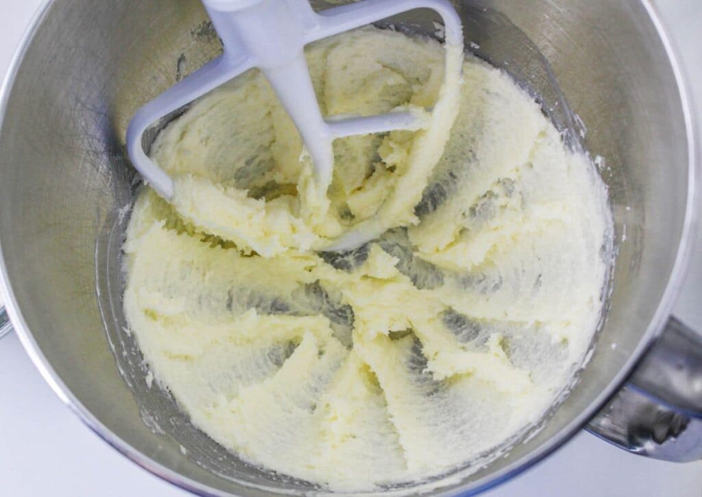 butter being mixed in a stand mixer