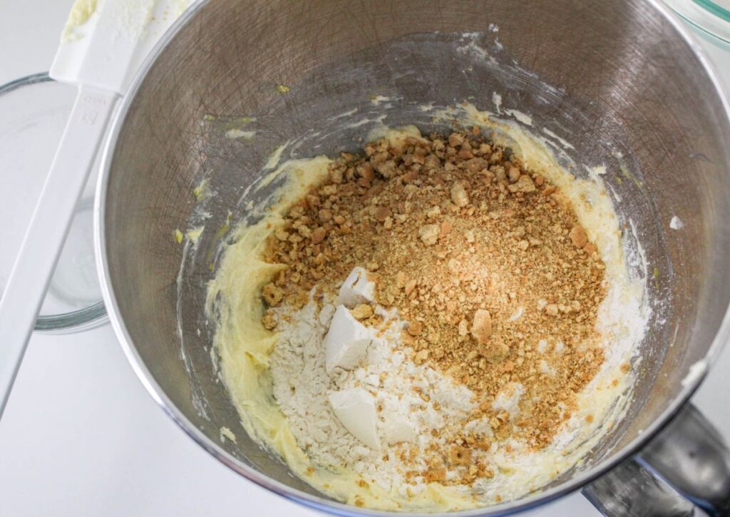dry ingredients being added to a stand mixer