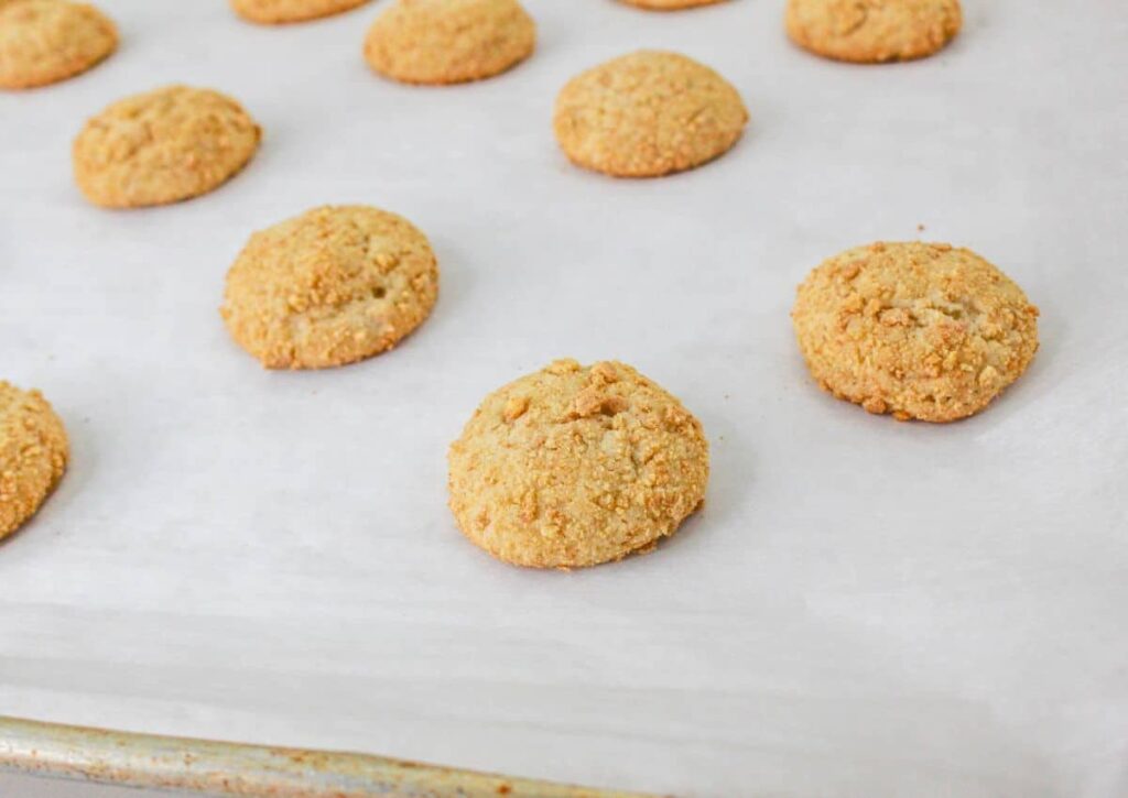 baked cookies on a parchment lined baking sheet