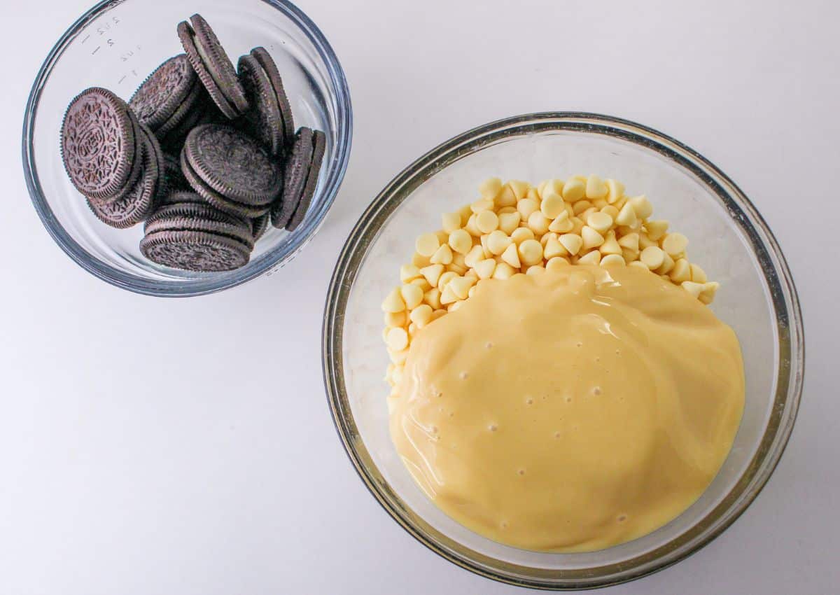 white chocolate chips and sweetened condensed milk in a large glass bowl.