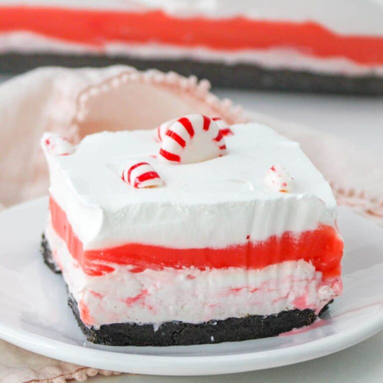 slice of candy cane lush on a plate with a fork.