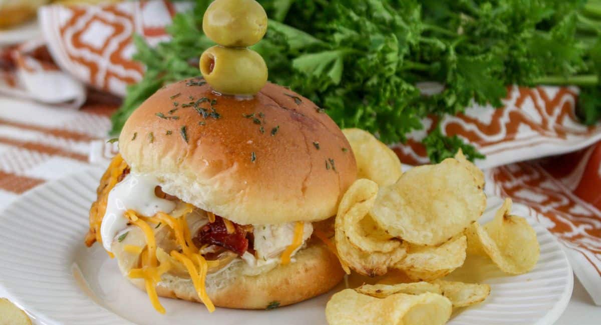 chicken bacon ranch slider and chips on a plate.
