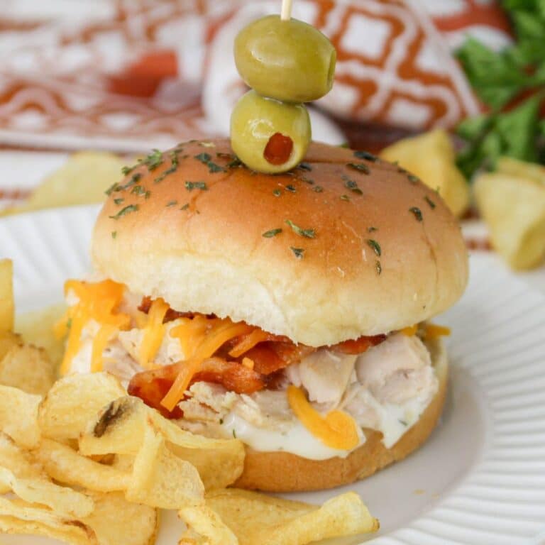 chicken bacon ranch slider and chips on a plate.