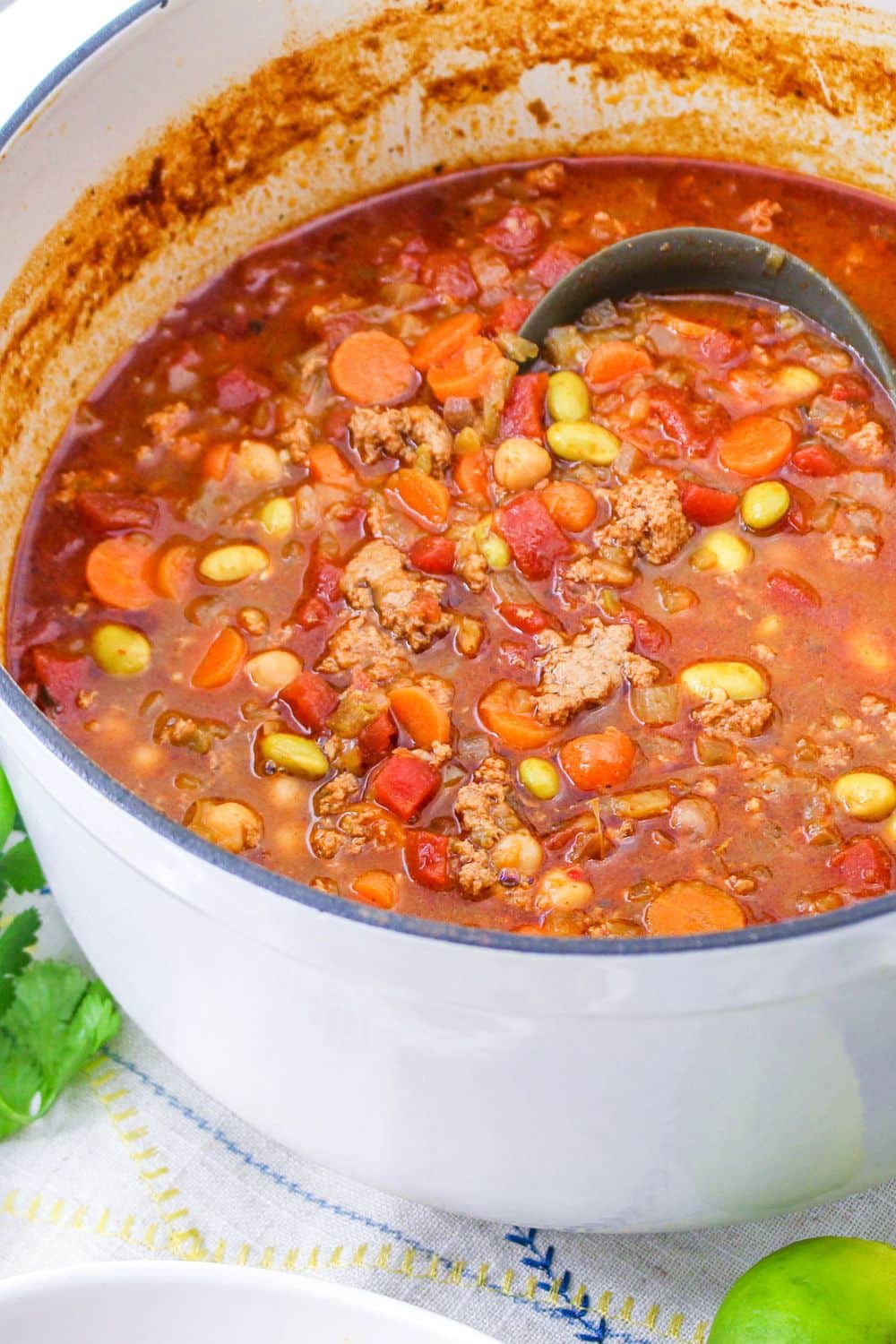 large pot full of a turkey chili with a ladle in the chili