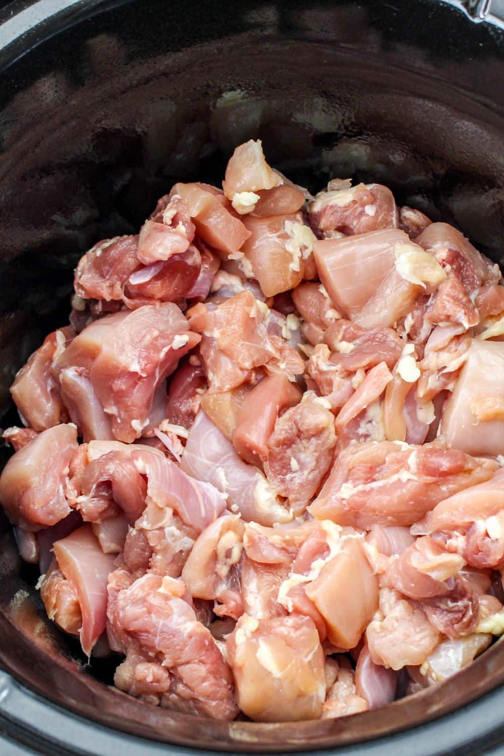 diced chicken thighs in a slow cooker