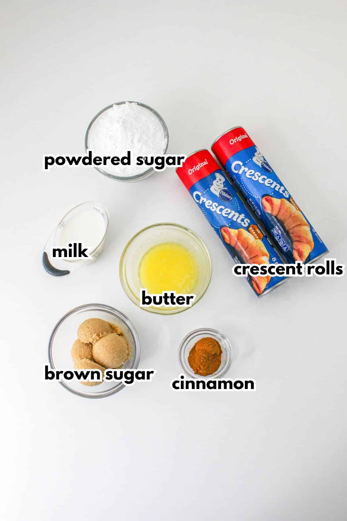 bowls of powdered sugar, milk, butter, brown sugar, cinnamon, crescent rolls.