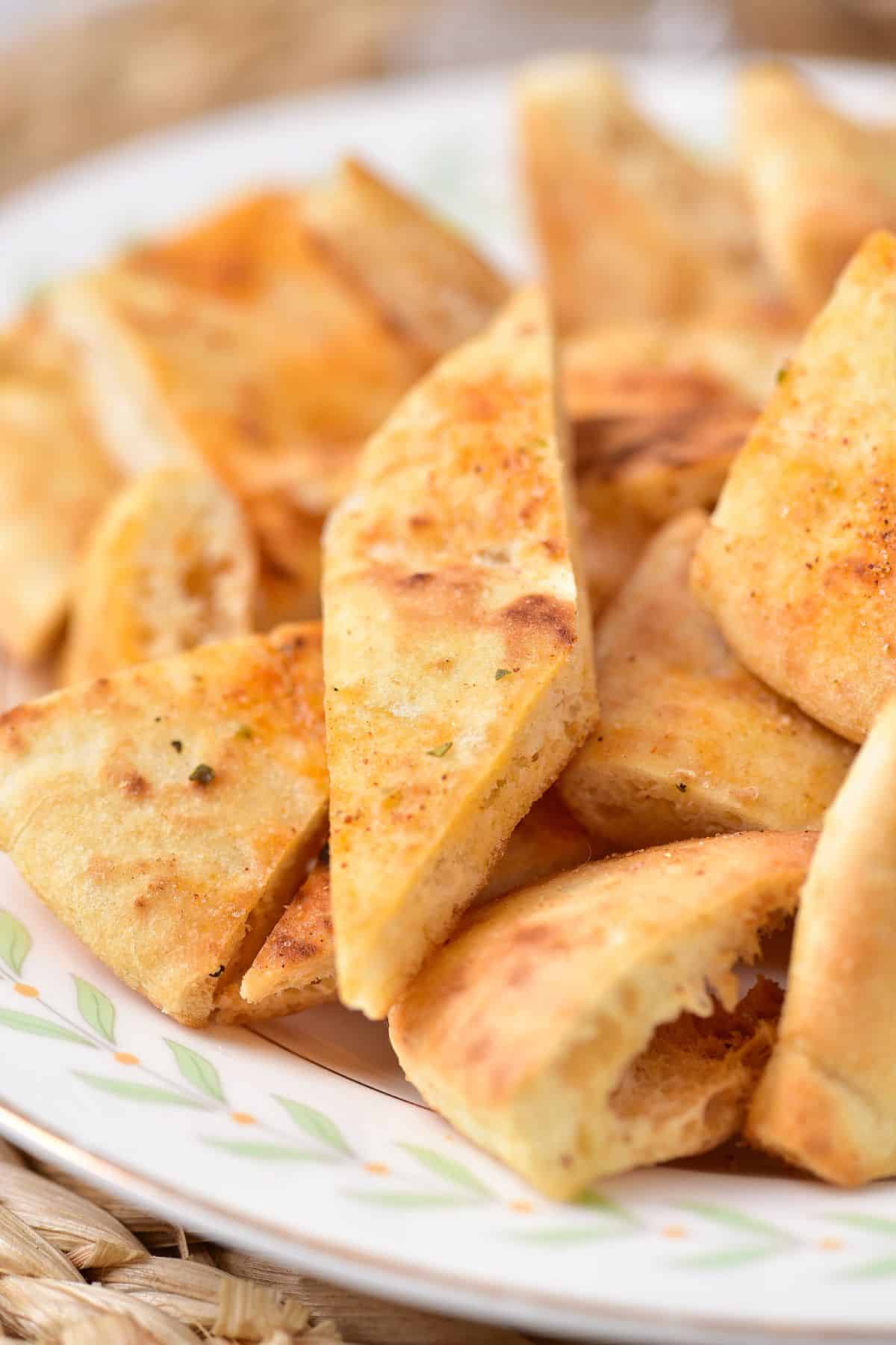 air fryer pita chips on a plate.