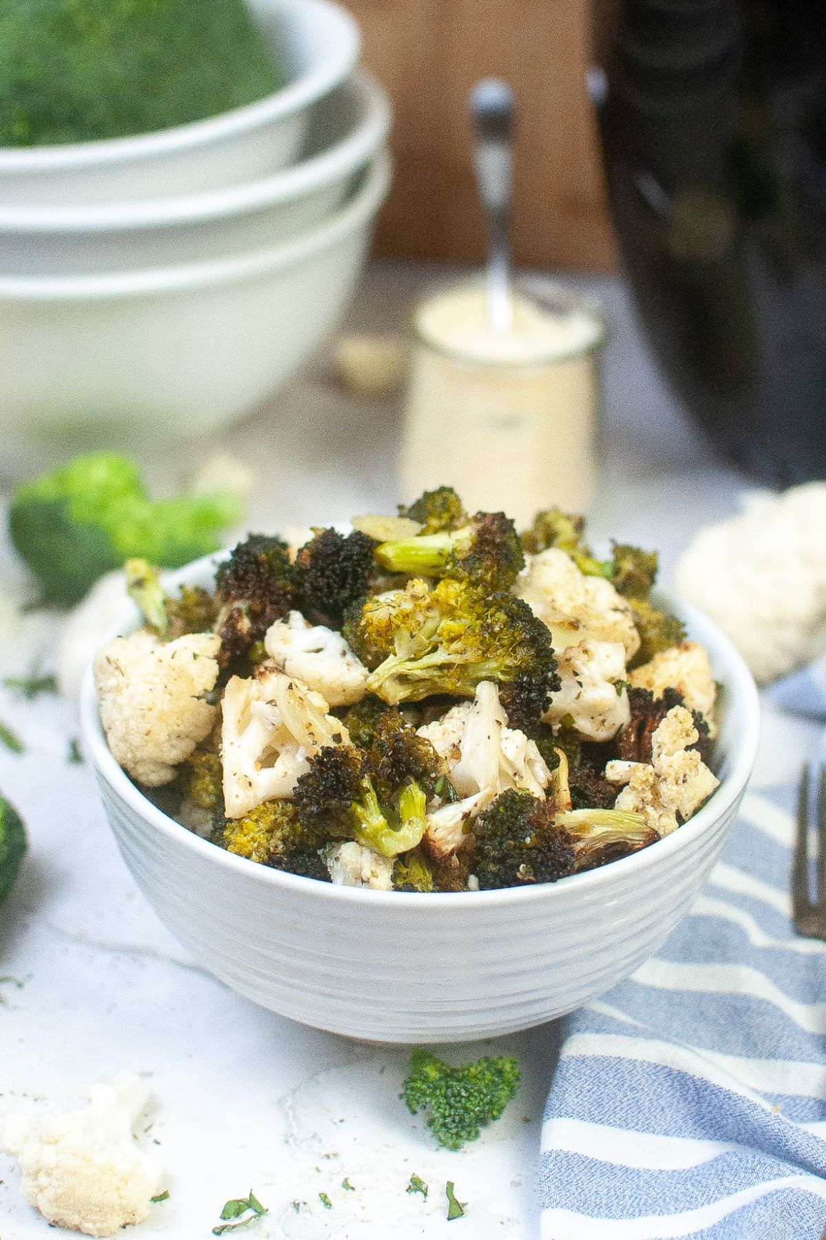 bowl full of seasoned air fryer broccoli and cauliflower.