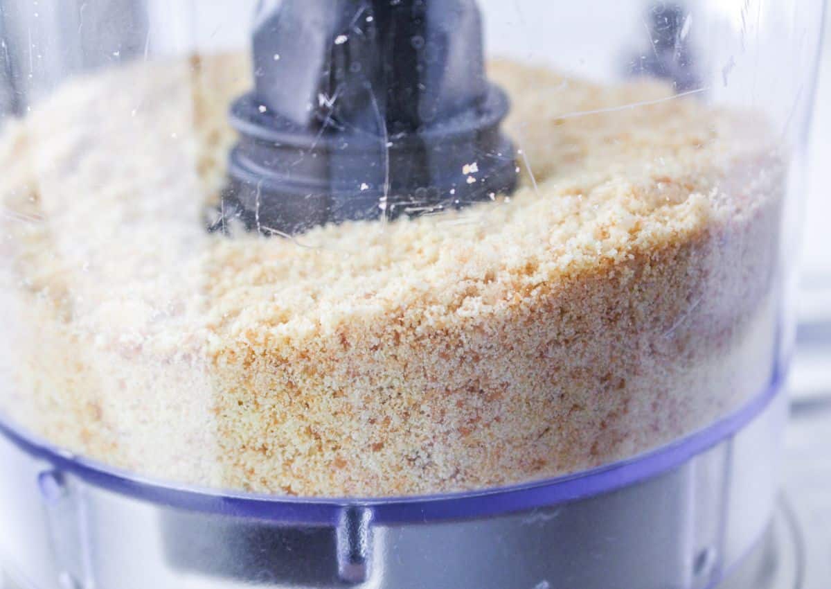 vanilla wafers being crushed in a food processor.
