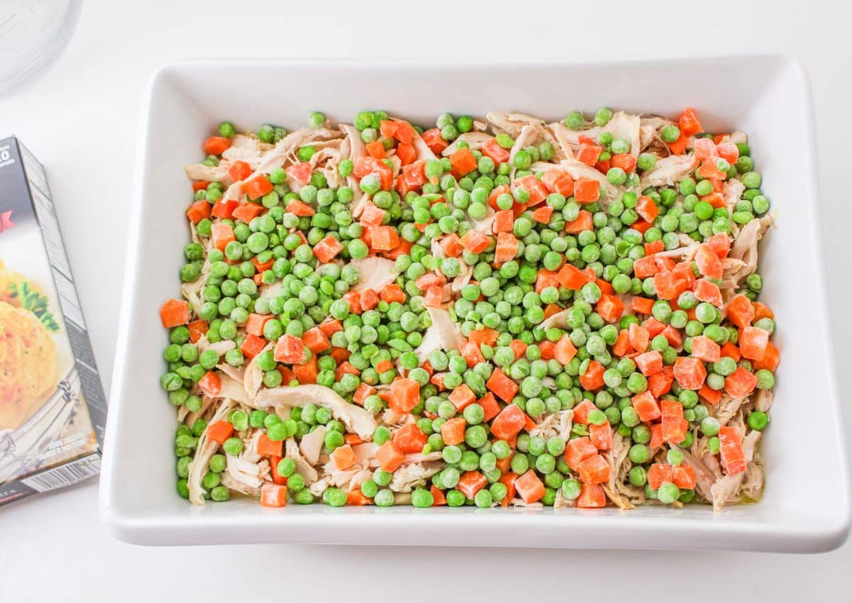 pea, carrots and shredded chicken in a casserole dish.