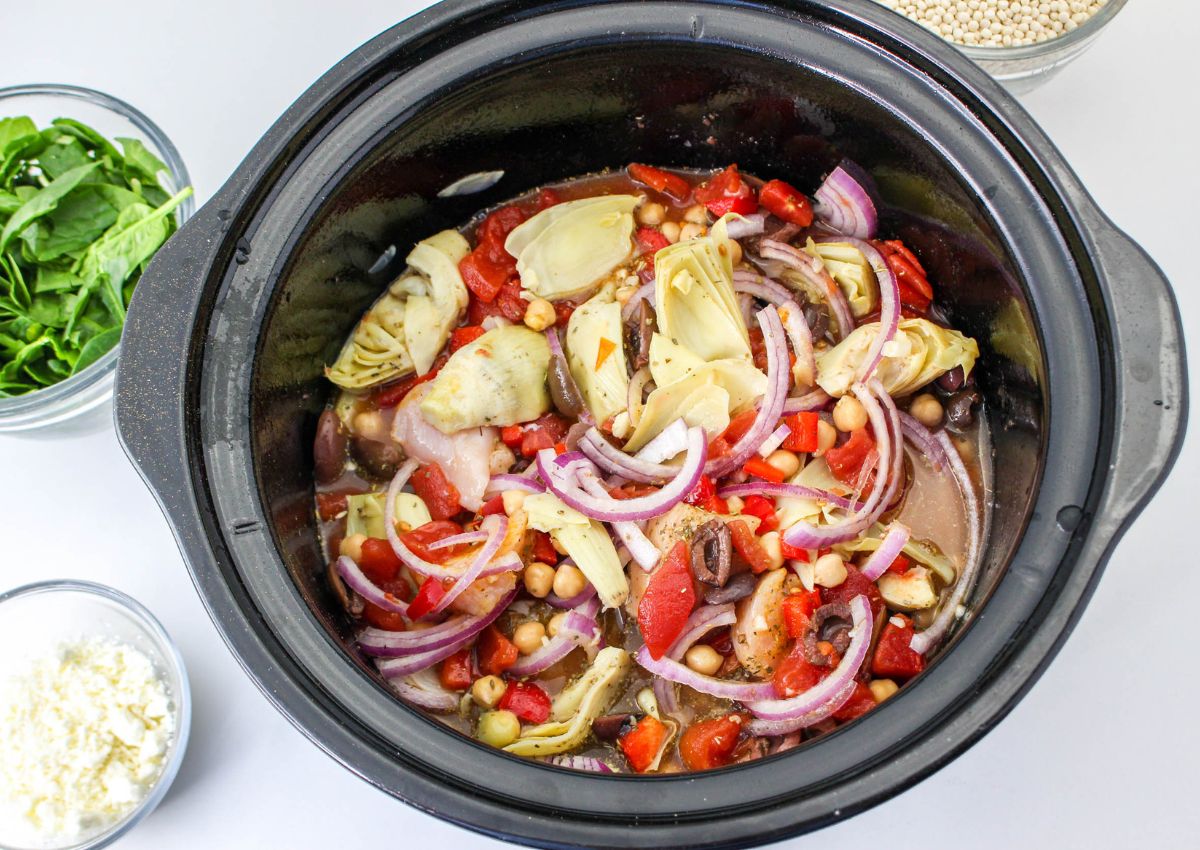 ingredients being added to a slow cooker.