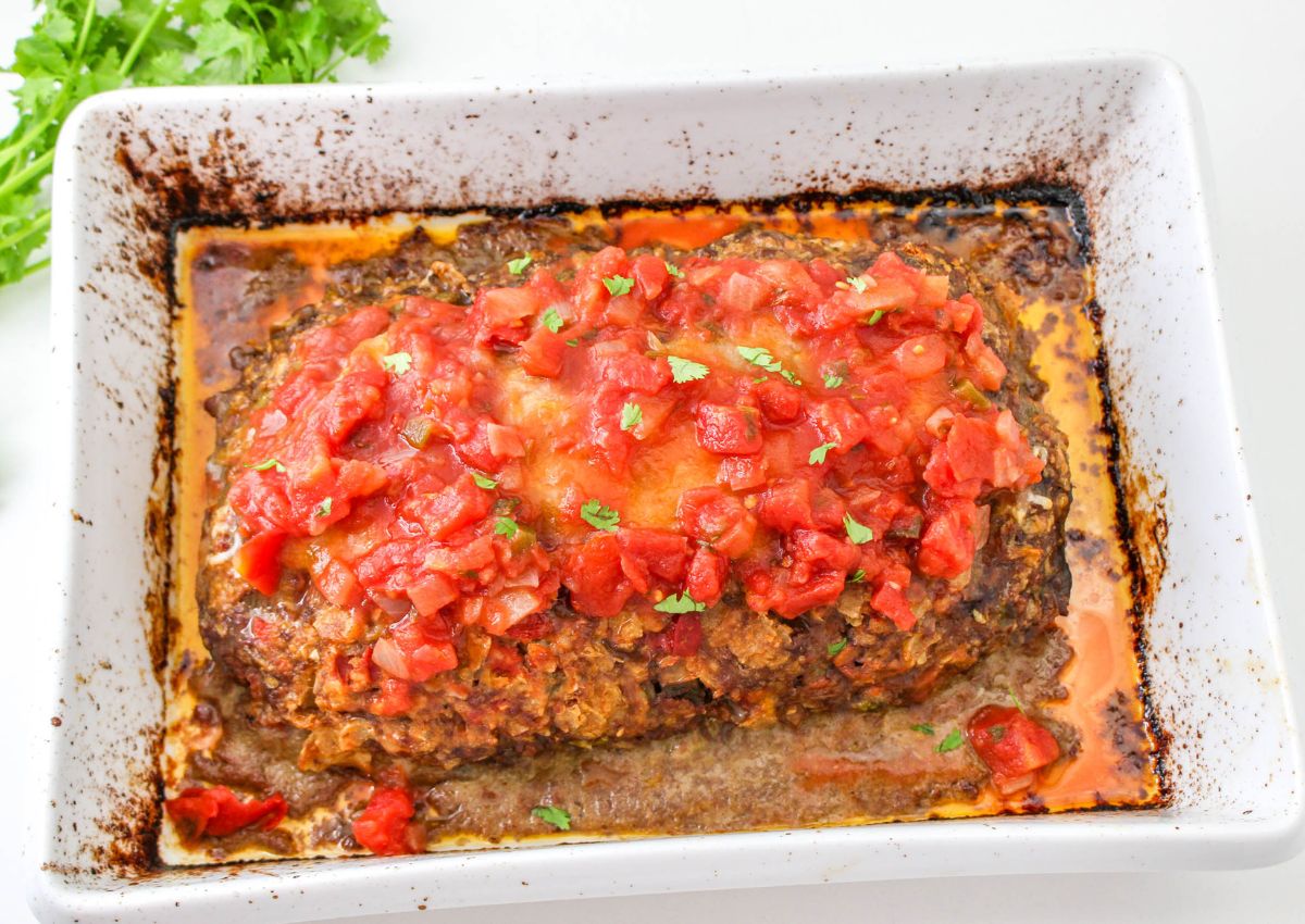 salsa being added on top of a taco meatloaf.