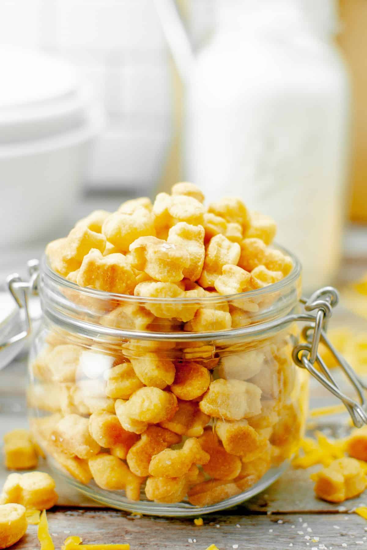 sourdough cheese crackers in a glass jar.