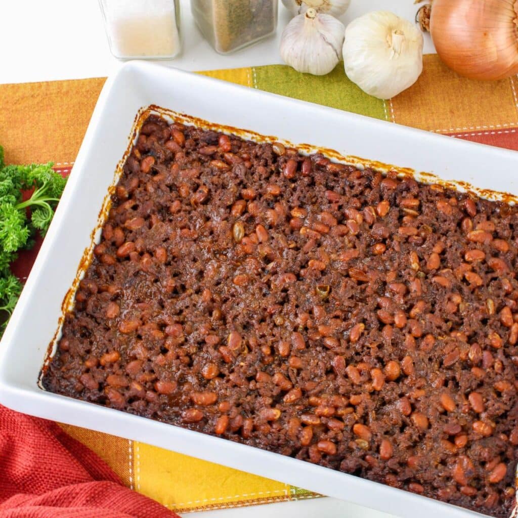 baked beans with hamburger in a casserole dish.