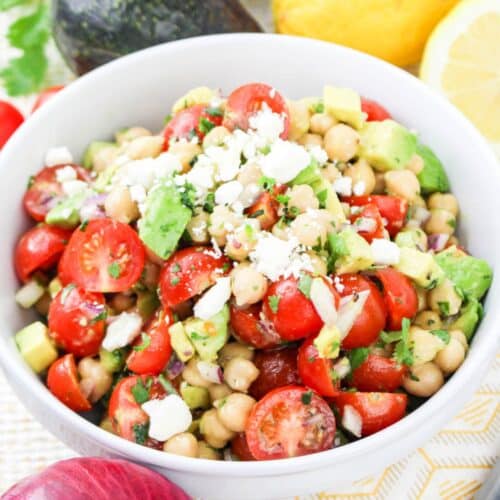 bowl full of chickpea and avocado salad.