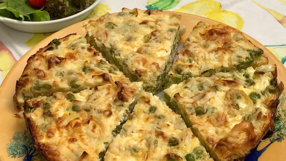 A crustless quiche with cottage cheese and peas.