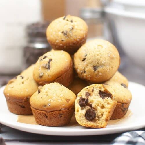stack of sourdough chocolate chip muffins on a plate.