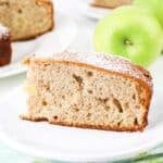 Slice of cinnamon apple cake on a plate.