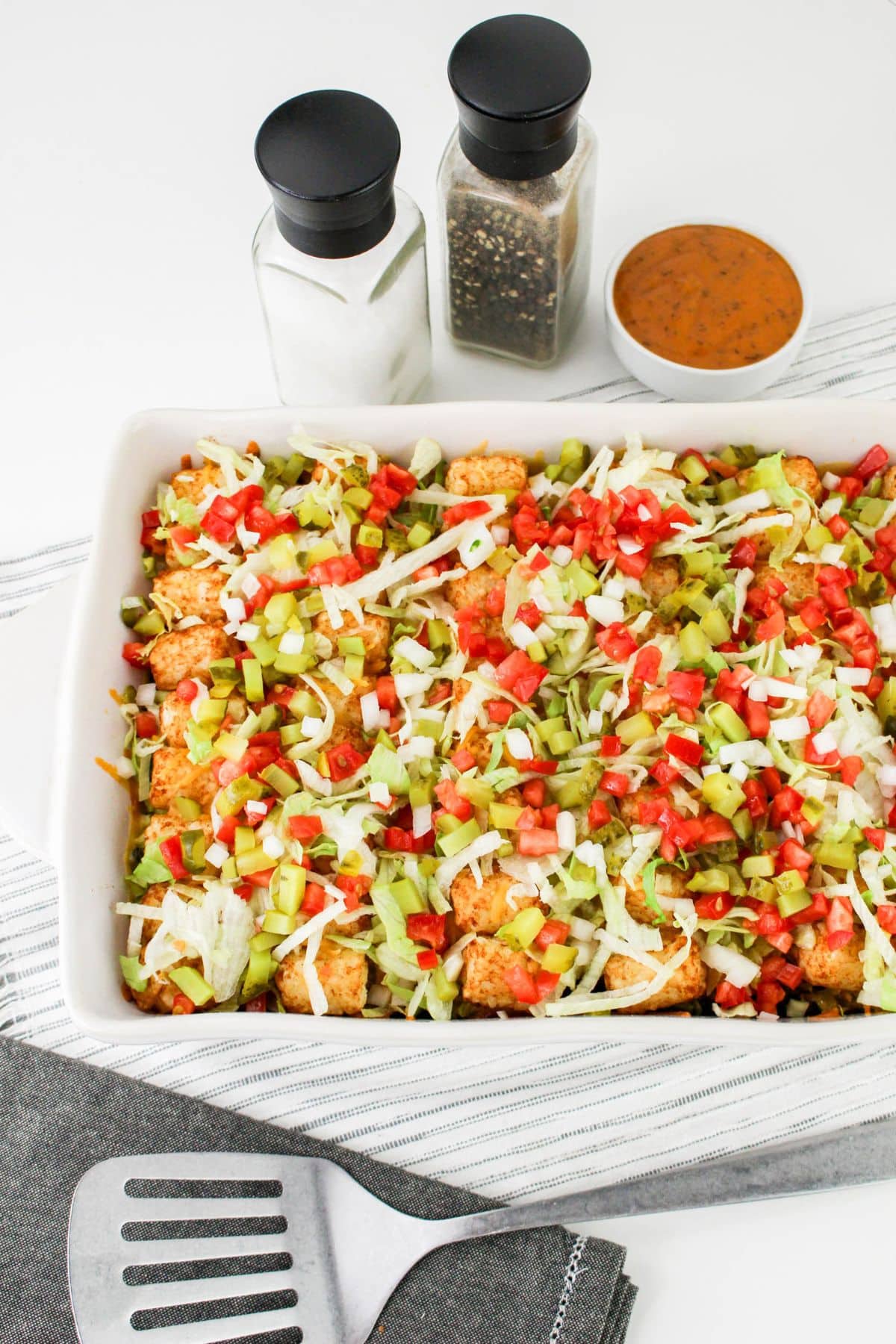 Casserole dish full of tater tot casserole.