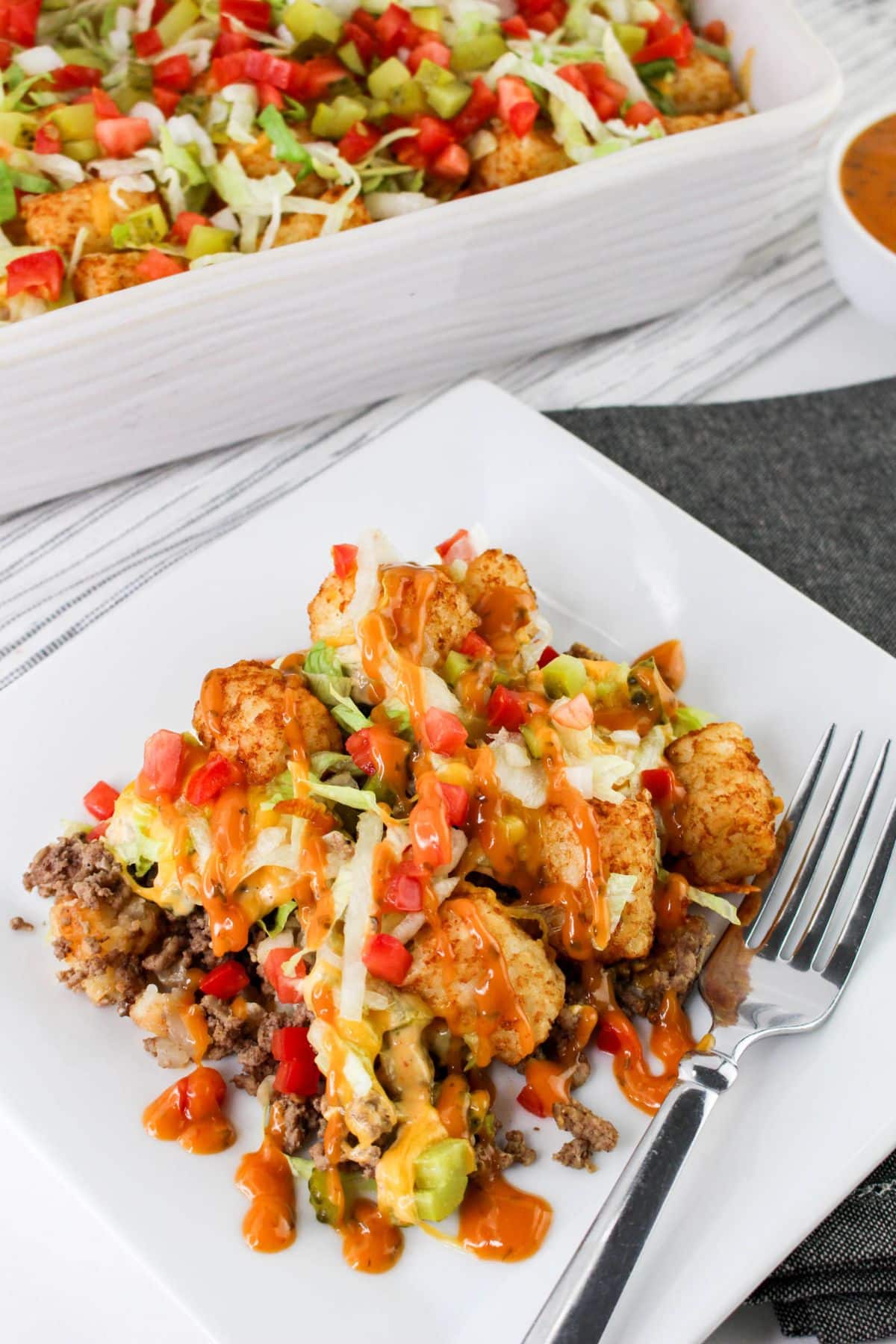 Plate with a serving of tater tot casserole on it.