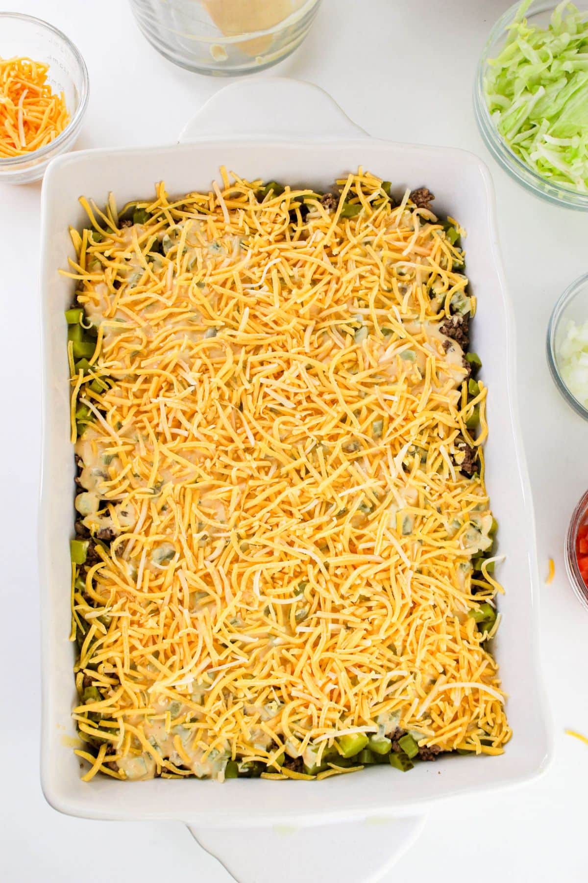 Shredded cheese on top of a casserole.