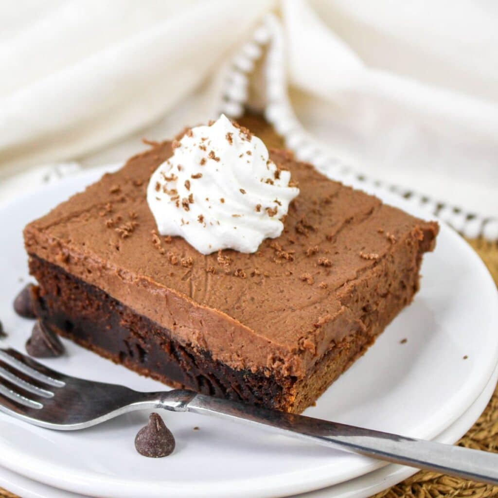 Slice of chocolate chocolate mousse cake on a plate.