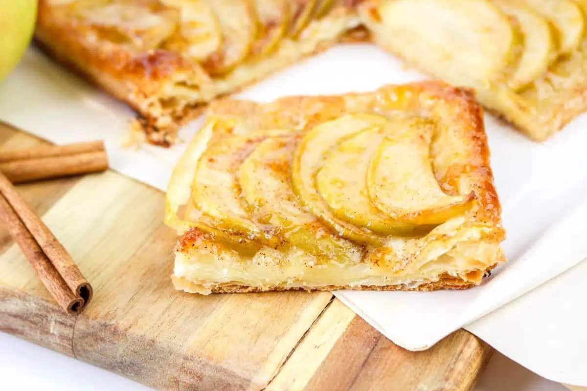 Puff Pastry Apple Tart slice on cutting board