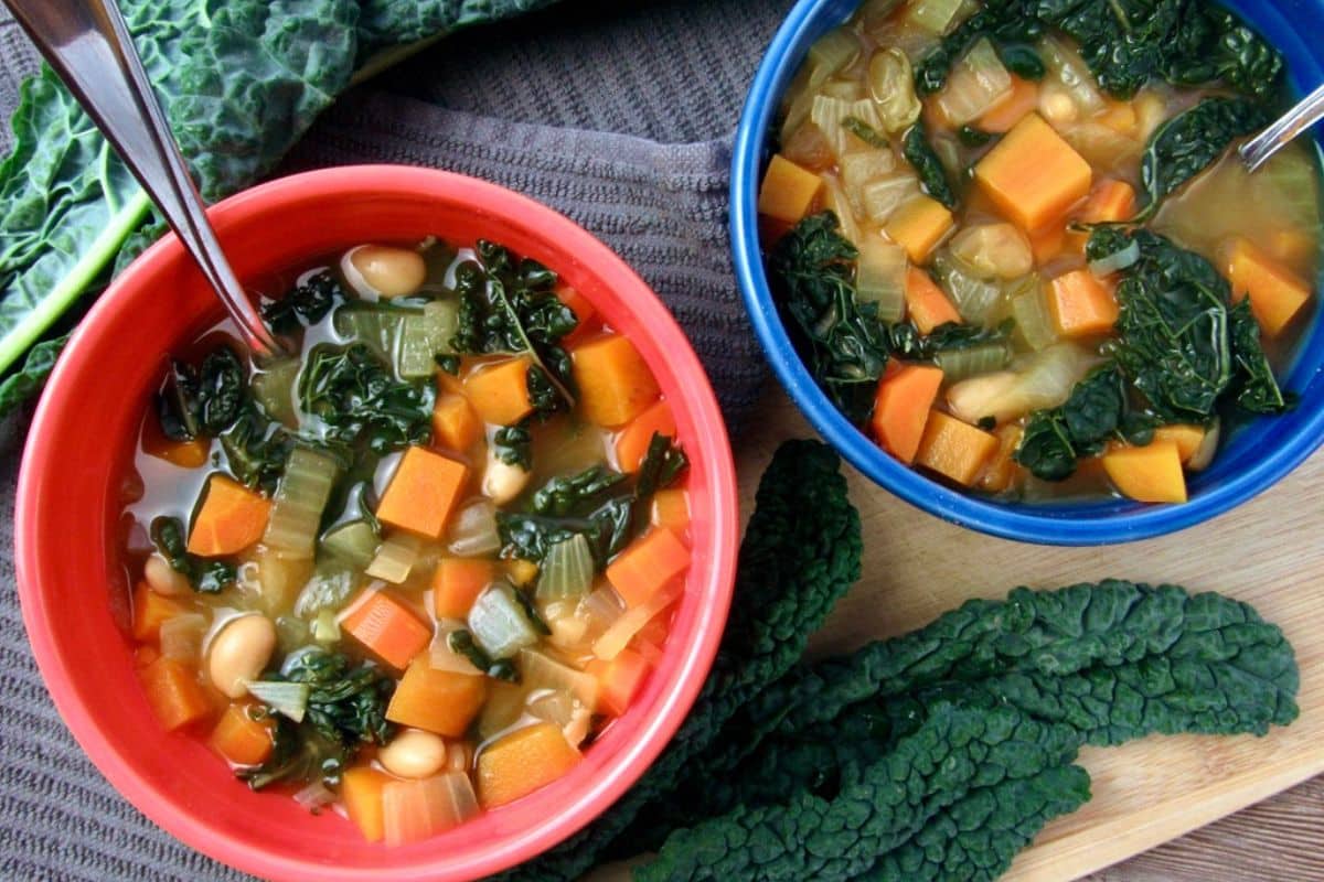 Sweet Potato and Kale Soup with onions carrots beans and spices