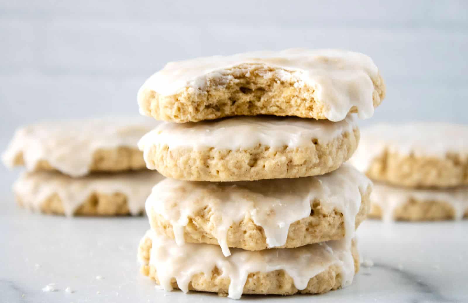 A stack of iced oatmeal cookies.