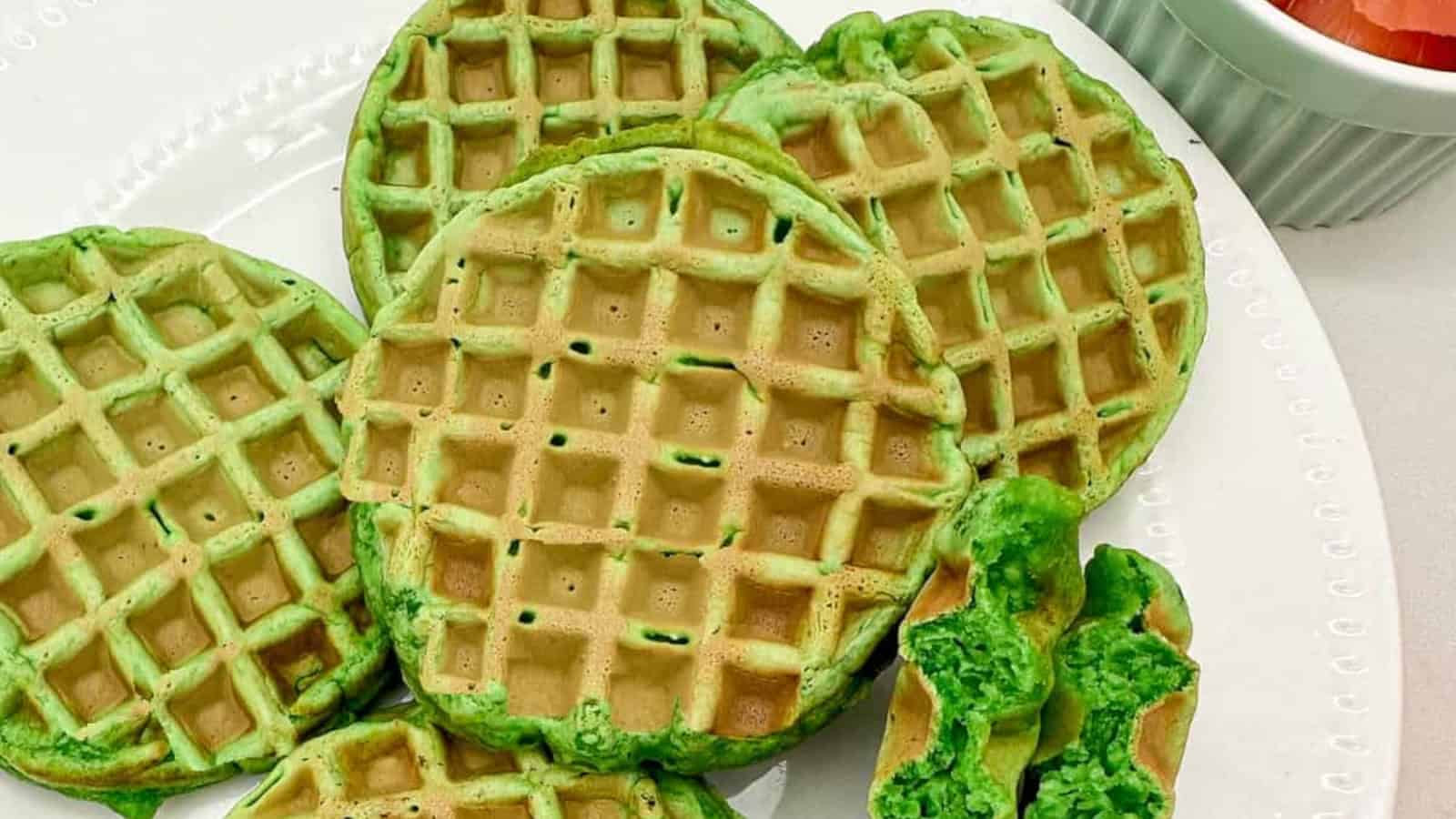 Crispy and fragrant waffles with a blend of coconut and pandan flavors on a white plate.