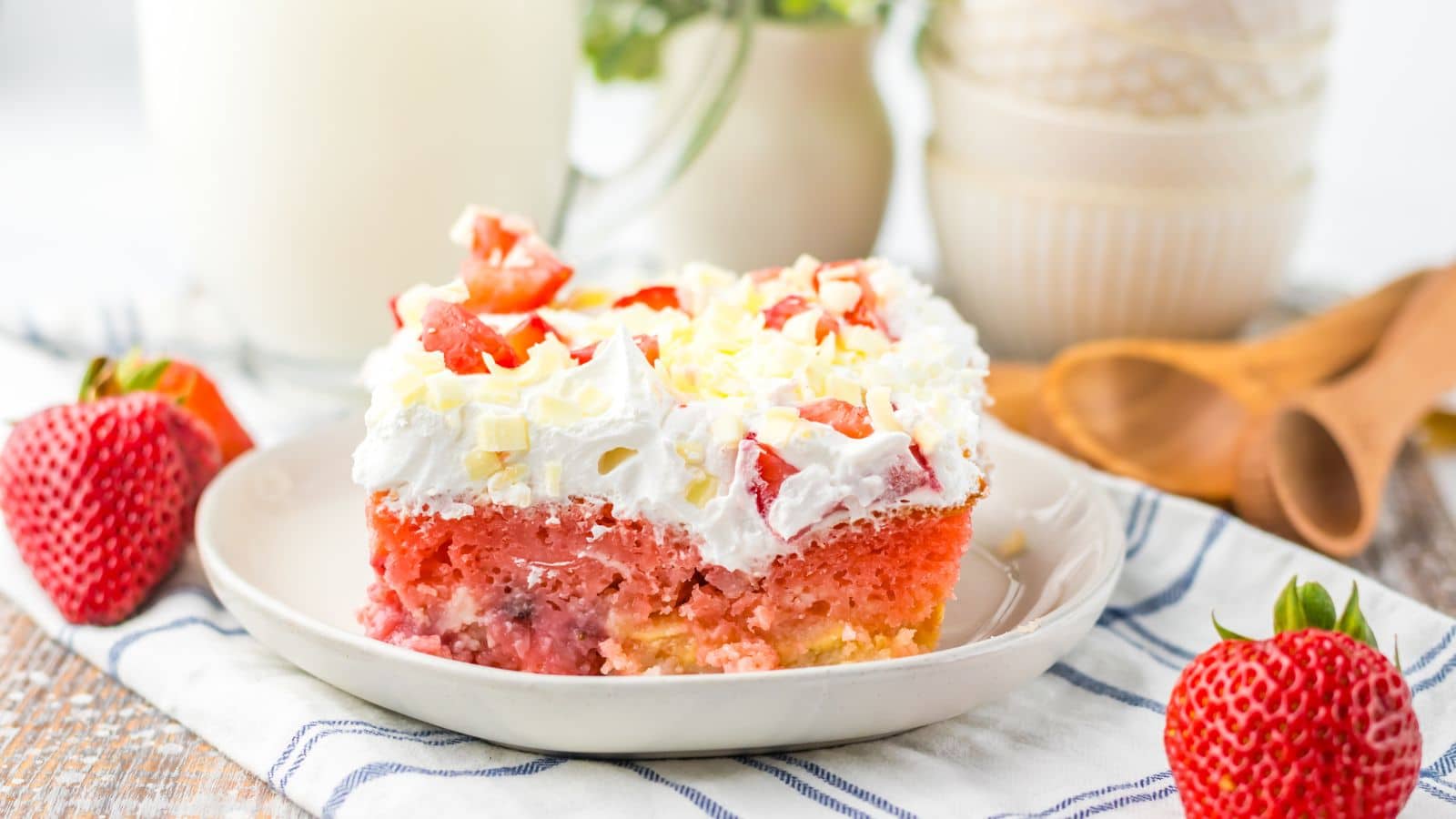 Slice of strawberry earthquake cake on a plate.