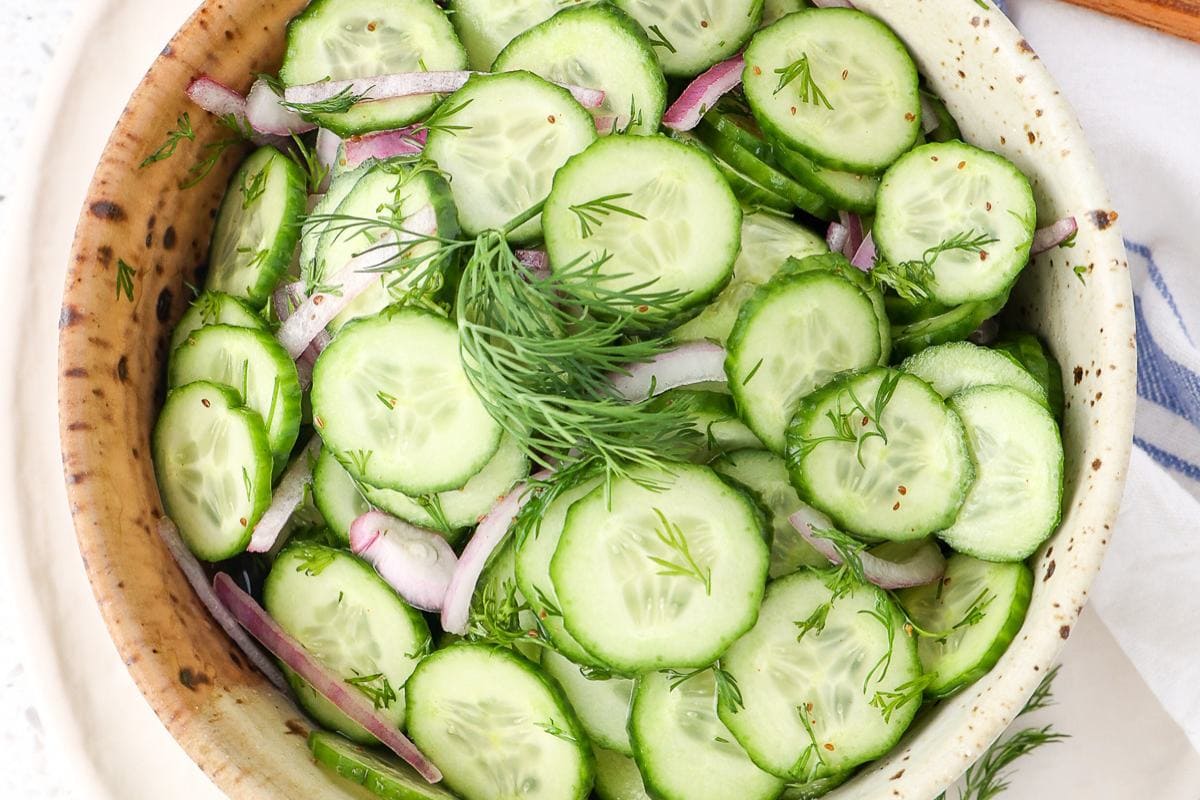A fresh cucumber salad with sliced cucumbers and a light dressing.