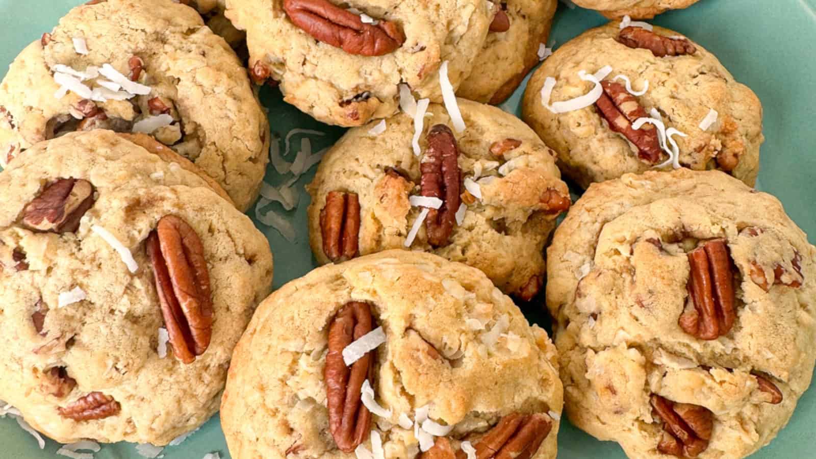 Chewy coconut pecan cookies on a green plate.
