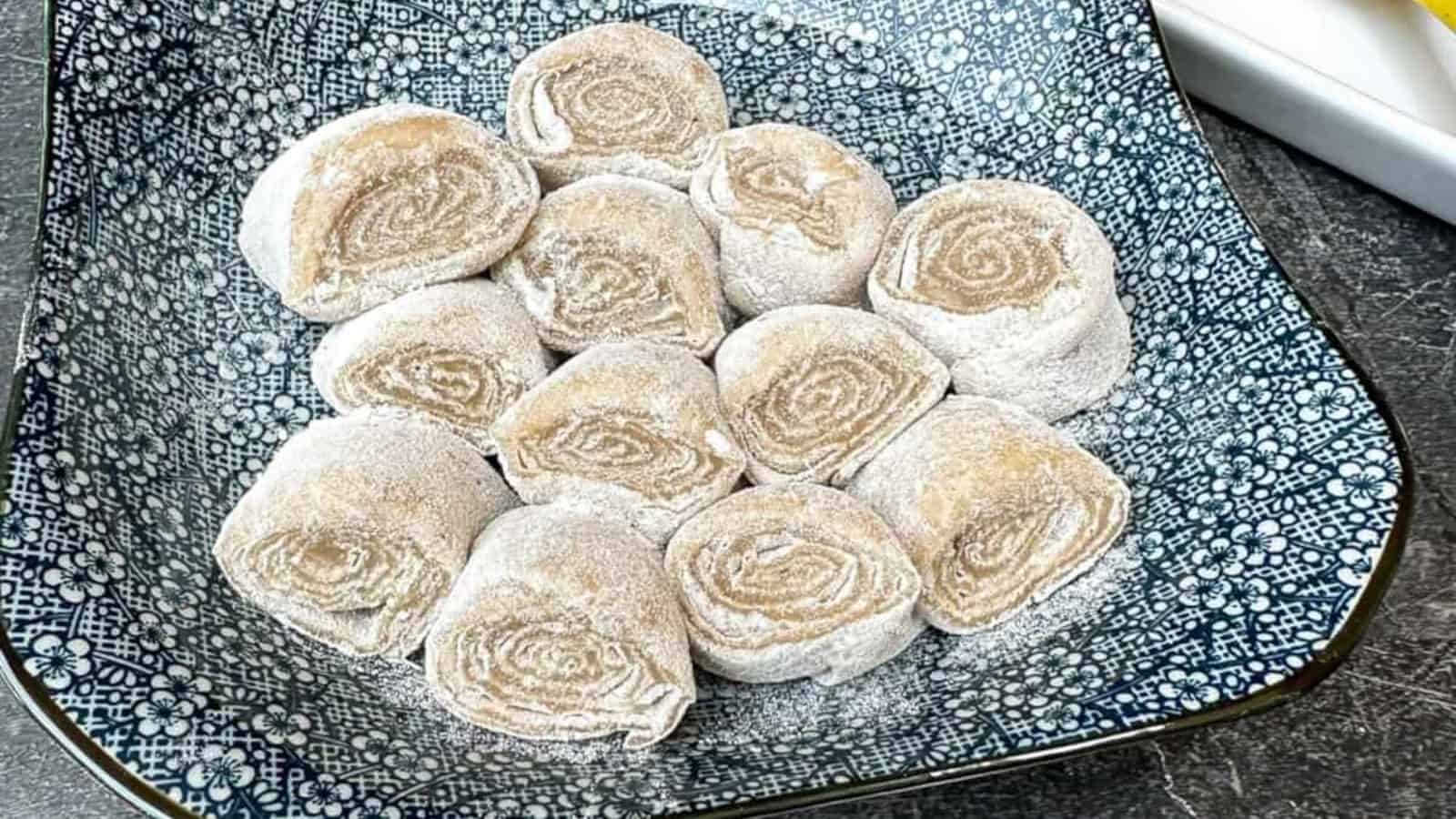 Soft, chewy banana mochi on a blue plate.