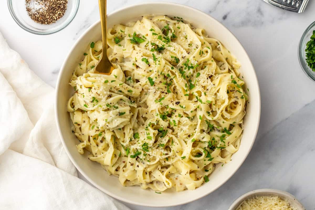 An overhead image of cottage cheese alfredo in a bowl.