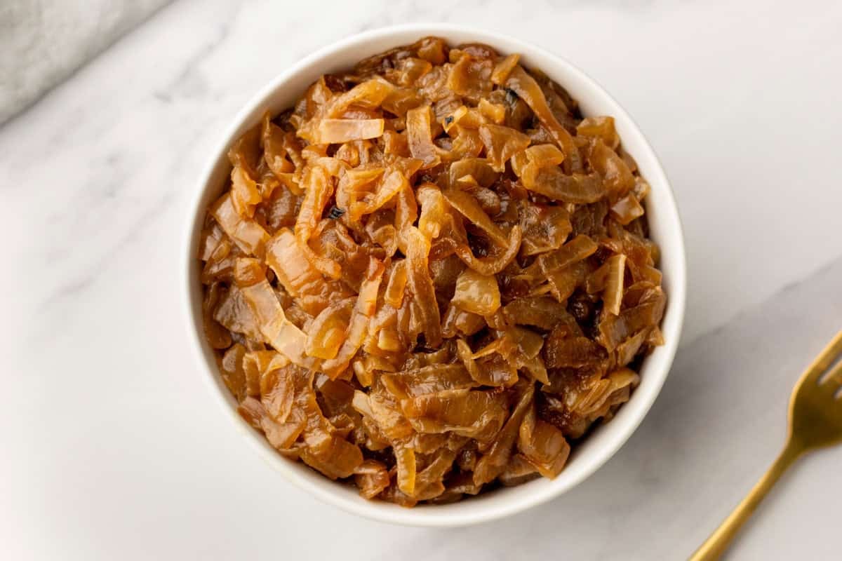 An overhead image of slow cooker caramelized onions in a bowl.