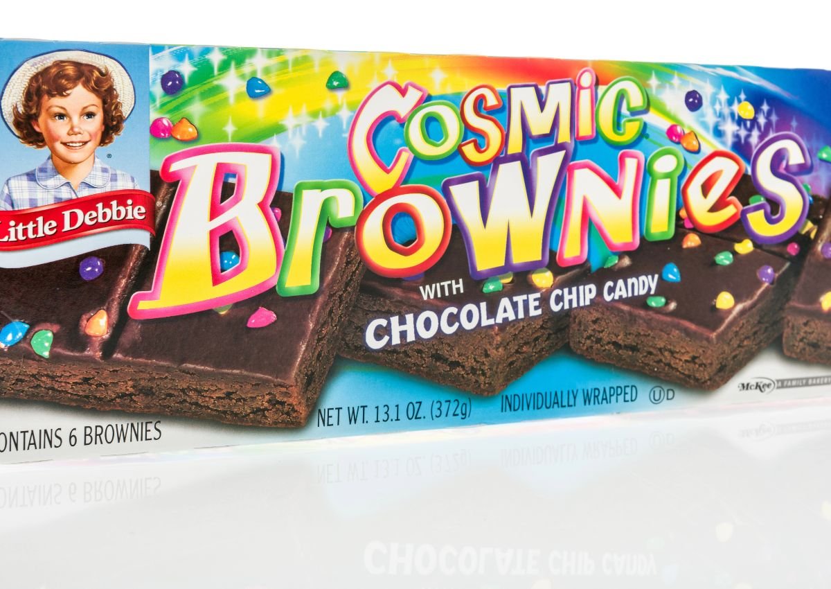 A box of Little Debbie Cosmic Brownies with chocolate chip candy, featuring colorful packaging and an image of six brownies on the front.