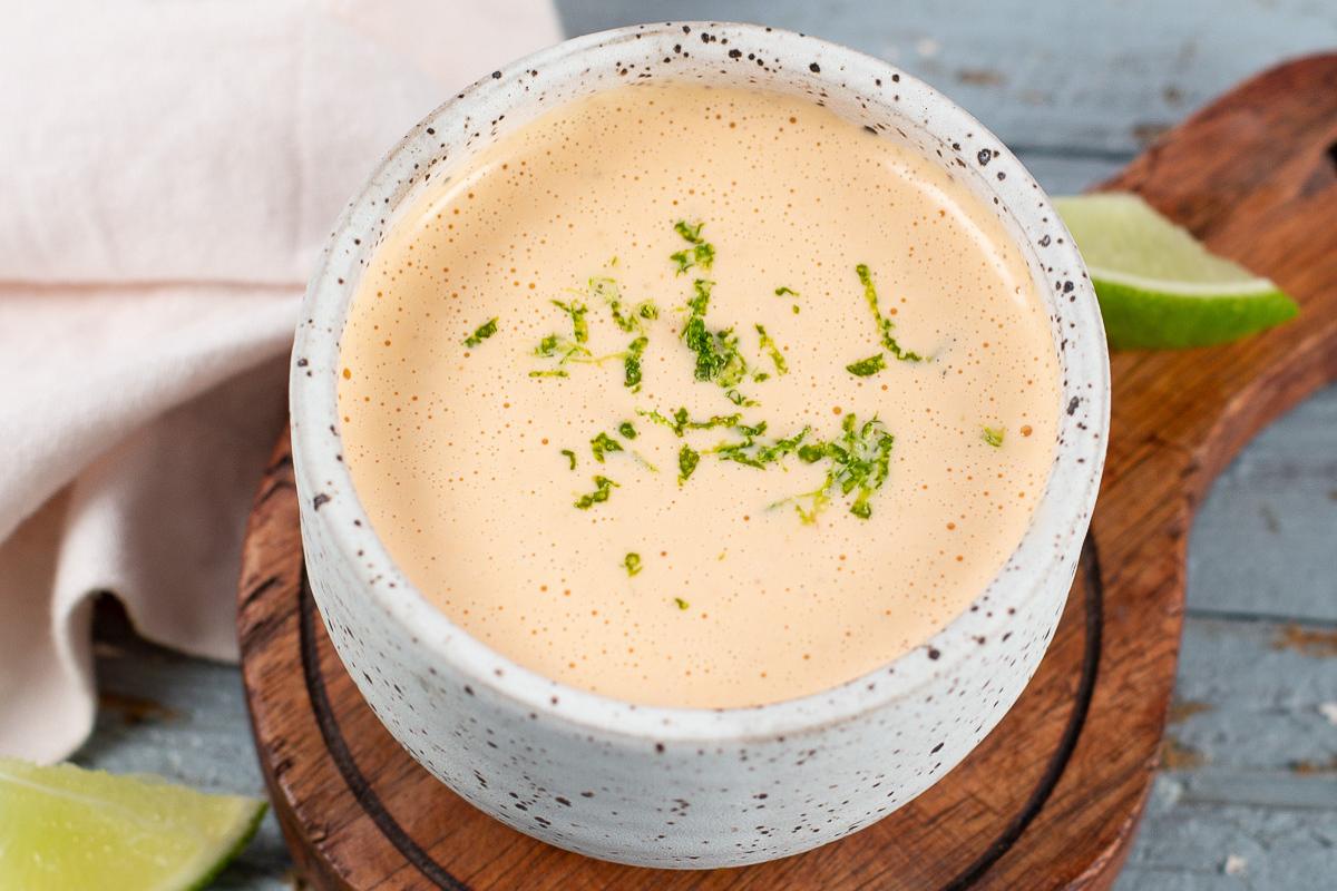 A jar of homemade Taco Bell Baja Sauce with a tangy and creamy texture.