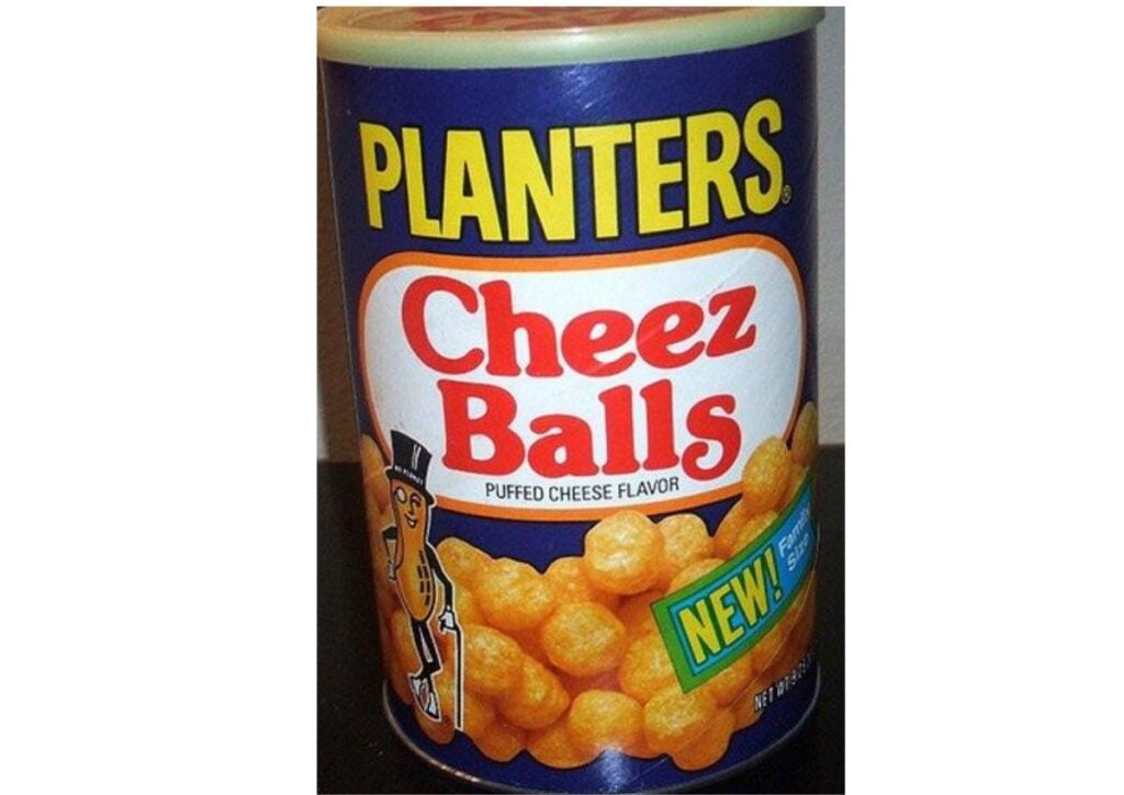 A canister of Planters Cheez Balls with NEW! and Puffed Cheese Flavor written on the label, showing orange cheese balls and the Planters mascot.