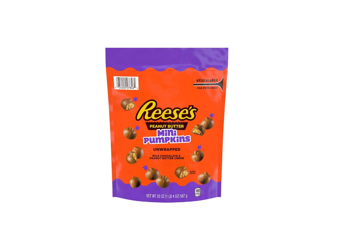 A 20 oz bag of Reeses Peanut Butter Mini Pumpkins, unwrapped, featuring milk chocolate and peanut butter creme, in orange and purple packaging.