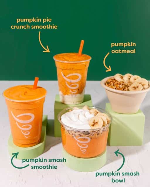 Three pumpkin-themed food items—a smoothie, a bowl, and oatmeal—are displayed on green platforms against a green background, each labeled with its name.