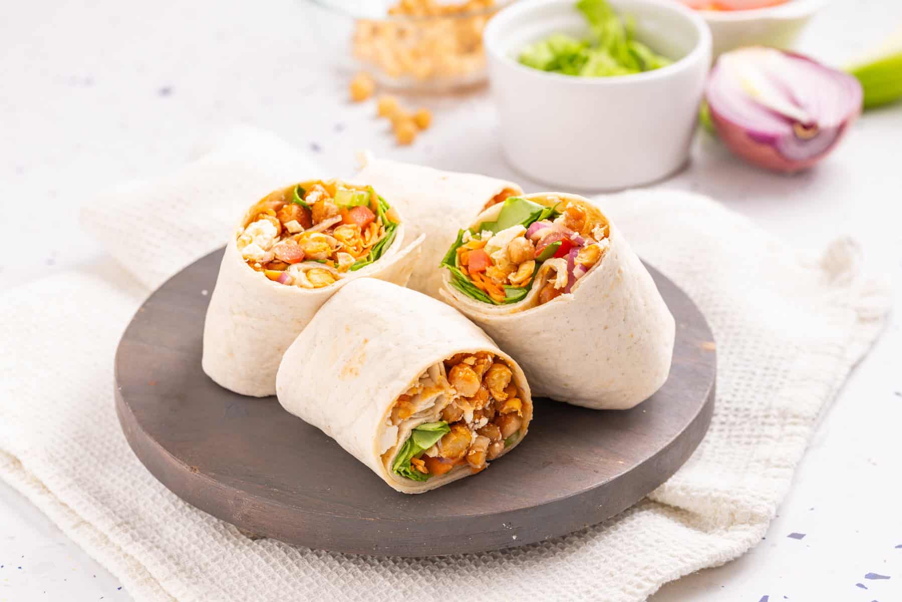 An image of buffalo chickpea wraps on a plate.