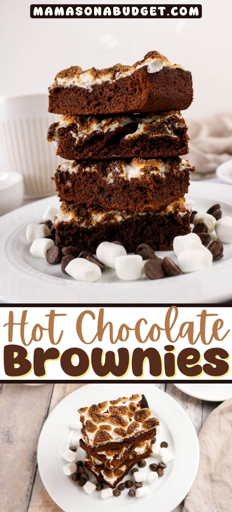 A stack of hot chocolate brownies topped with marshmallows and chocolate chips on a white plate, surrounded by extra marshmallows and chocolate chips.