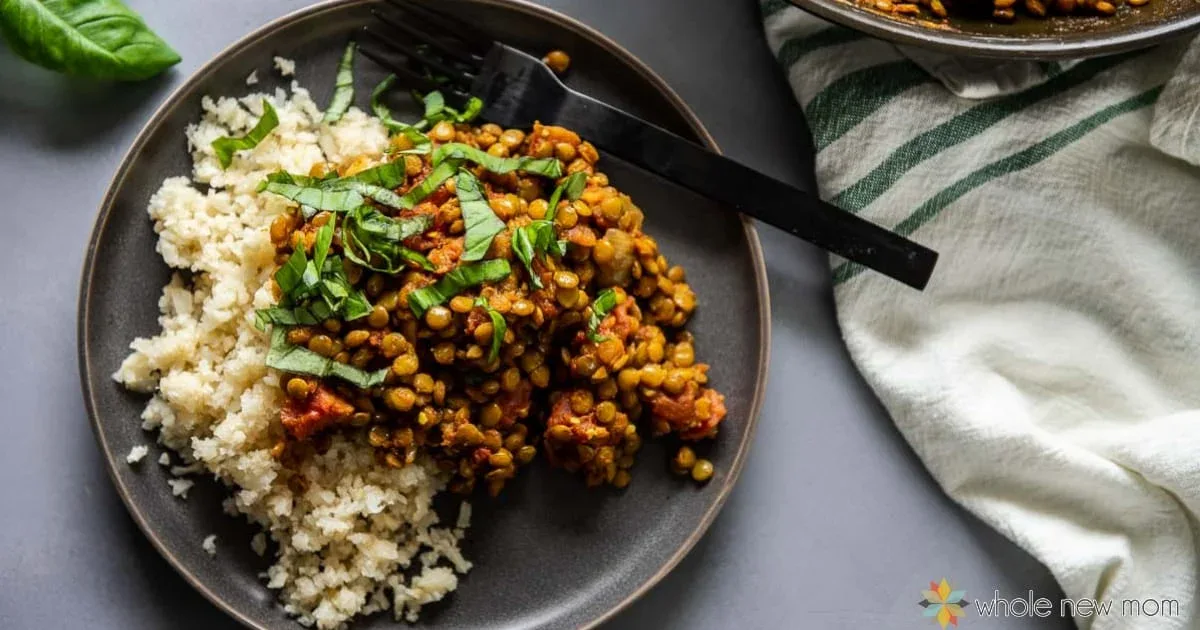 A plate of food with a fork and a plate of rice.