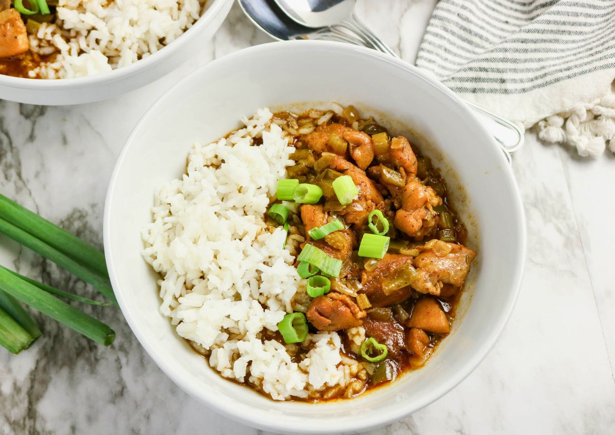 A bowl of rice and meat.