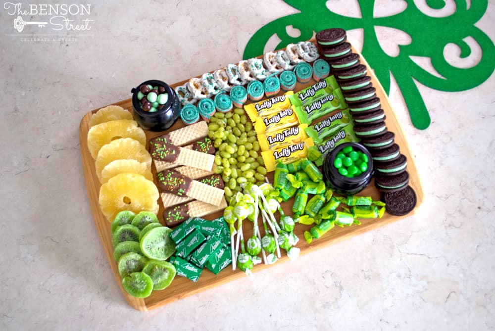 A board with different colored food.